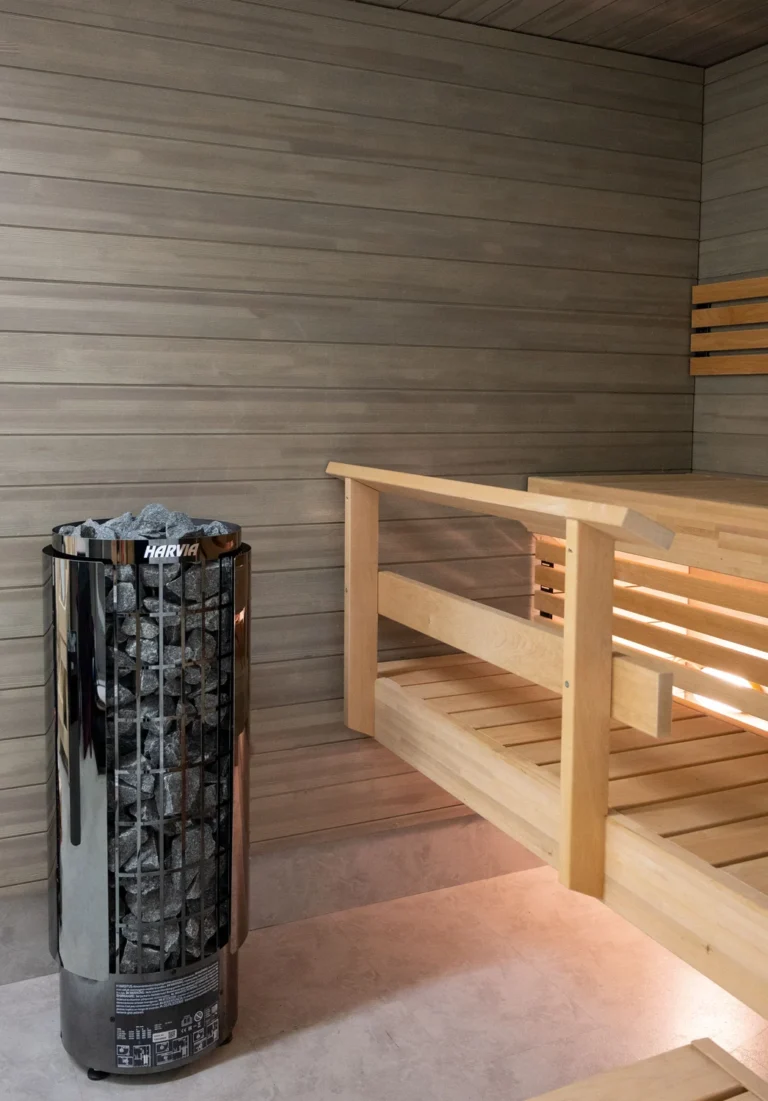 Harvia Cilindro PC70E black steel pillar heater in a sauna room